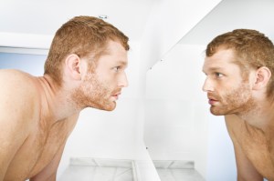 man-looking-in-mirror